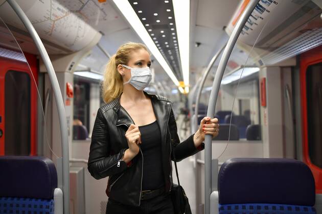Woman with face mask, standing in S Bahn, Corona crisis, Stuttgart, Baden Württemberg, Germany, Europe Copyright: imageBROKER/MichaelxWeber iblimw05764813