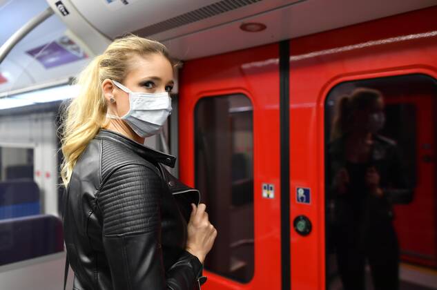 Woman with face mask, standing in S Bahn, Corona crisis, Stuttgart, Baden Württemberg, Germany, Europe Copyright: imageBROKER/MichaelxWeber iblimw05764815
