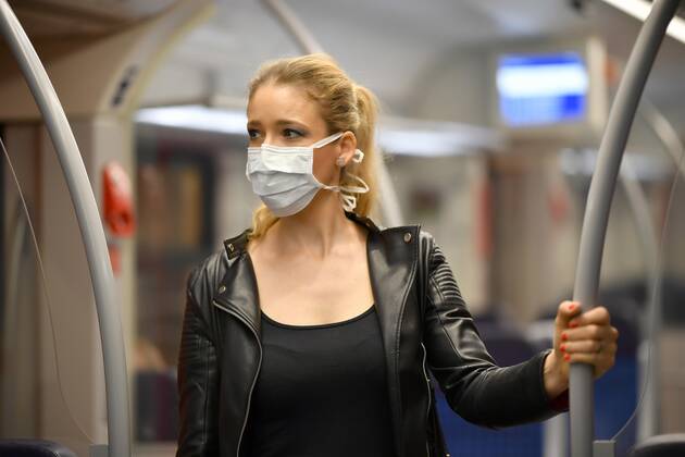 Woman with face mask, standing in S Bahn, Corona crisis, Stuttgart, Baden Württemberg, Germany, Europe Copyright: imageBROKER/MichaelxWeber iblimw05764822