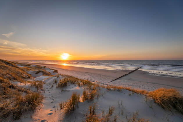 Norderney 15 APR 2020 Sunset in the dunes on the north beach of Norderney EAST FRIESLAND East Frisian Islands Copyright: JanisMEYER Priller&MAUG JMY00G390X