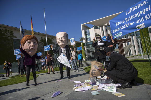 Campact activists and other demonstrators protest against rescue aid for the airline Lufthansa in front of the Chancellors Office in Berlin on 27 May 2020