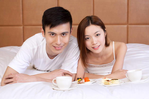 A couple enjoying life in a hotel room  55295075424535909