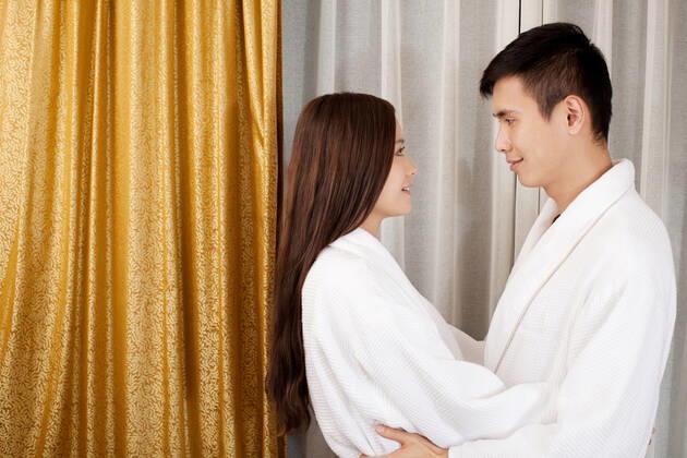 A couple enjoying life in a hotel room  55295075424535973