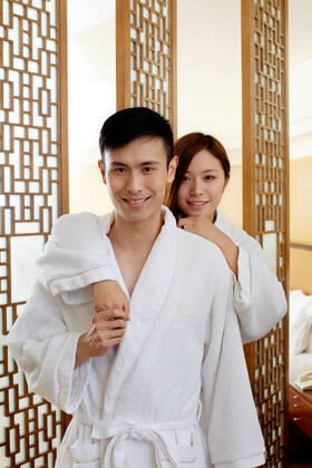 A couple enjoying life in a hotel room  55295075424536051