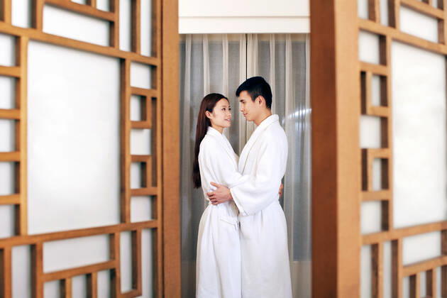 A couple enjoying life in a hotel room  55295075424537249