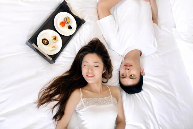A couple enjoying life in a hotel room  55295075424537398