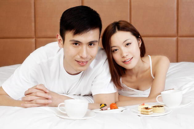 A couple enjoying life in a hotel room  55295075424538312