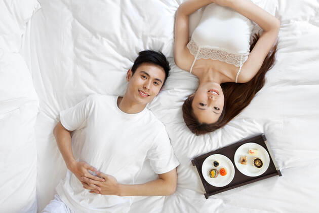 A couple enjoying life in a hotel room  55295084014470443