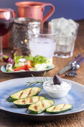 grilled courgette with tzatziki and salad 1035306577