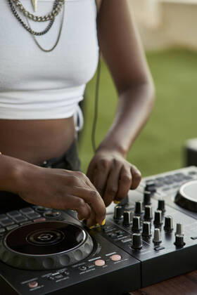 Crop view of DJane working on mixing board model released Symbolfoto property released VEGF02115
