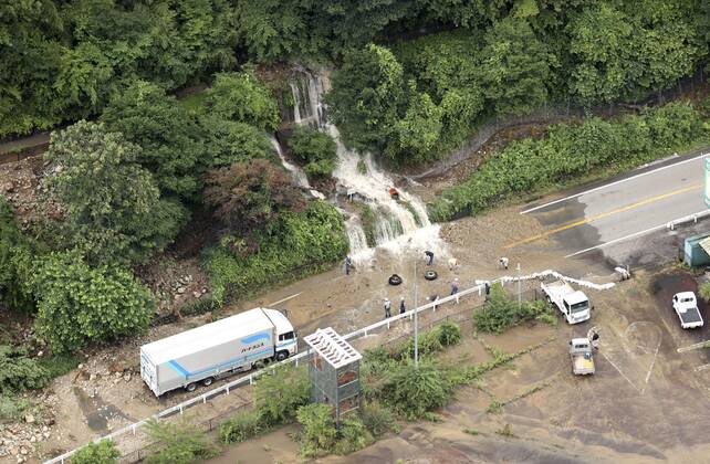 Torrential rain in central Japan Photo taken from a Kyodo News helicopter on July 8, 2020, shows a mud-covered road in Gero in Gifu Prefecture, central Japan, following torrential rain.