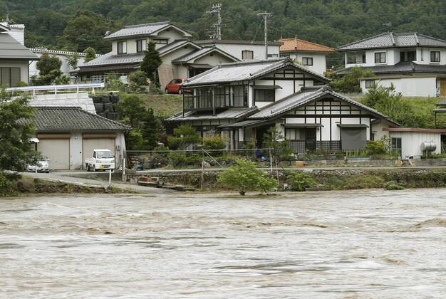 Torrential rain in central Japan Photo taken July 8, 2020, shows the swollen Sai River in Azumino in Nagano Prefecture as torrential rain lashes central Japan.