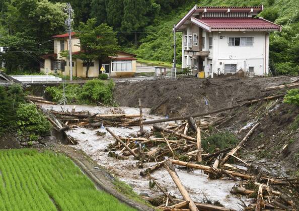 Torrential rain in central Japan Photo taken on July 8, 2020, shows the site of a mudslide in Takayama in Gifu Prefecture after torrential rain lashed central Japan.