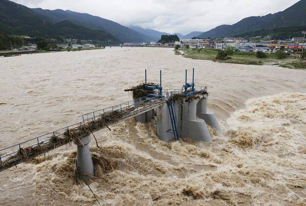 Torrential rain in central Japan Photo taken on July 8, 2020, shows the swollen Hida River in Gero, Gifu Prefecture, central Japan, after torrential rain.