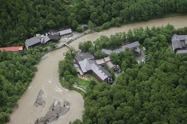 Torrential rain in central Japan Photo taken from a Kyodo News helicopter on July 8, 2020, shows a swollen river in Matsumoto, Nagano Prefecture, central Japan, after torrential rain.