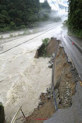 Torrential rain in central Japan Photo taken July 9, 2020, shows a collapsed section of a national road in Takayama in Gifu Prefecture, central Japan, following torrential rain.