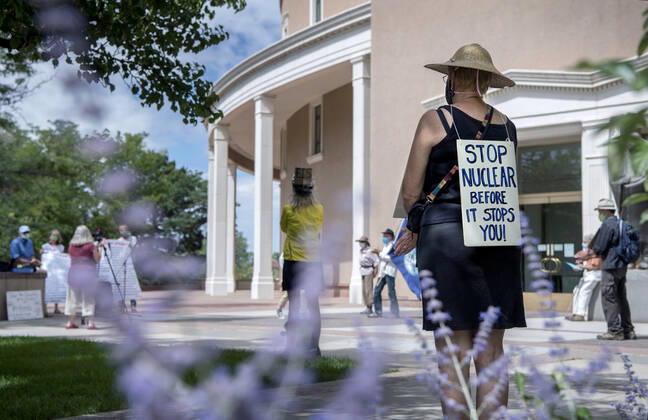 July 16, 2020, USA: Chrysa Wikstrom, from Santa Fe, joins around 25 people for a socially distanced, face mask wearing protest of nuclear weapons outside the Roundhouse in Santa Fe, Thursday July 16, 2020. The protest led by the Los Almaos Study Group was protesting against nuclear weapons on the 75th anniversary of the first test of an atomic bomb built at Los Alamos and detonated at the Trinity Site near Alamogordo in 1945. USA - ZUMAab1_ 20200716_zaf_ab1_006 Copyright: xEddiexMoorex