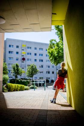 31 July 2020 Leipzig Saxony , Gruenau district A child is standing in front of a prefabricated building in Leipzig Gruenau