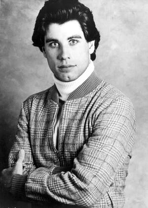 SATURDAY NIGHT FEVER JOHN TRAVOLTA Date: 1977. Strictly editorial use only in conjunction with the promotion of the film. Credit line mandatory. This image is copyright of the film company and is supplied under the terms of issue as film still. No commercial or book cover use permitted without prior consent from the film company.  Mandatory credit line: Image courtesy Robert Stigwood Organization Paramount Pictures Ronald Gra