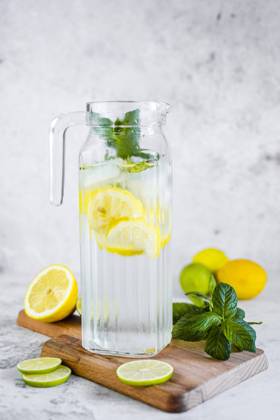 Detox water with lemon, lime and mint and ice cubes GIOF08702