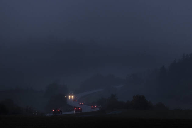 Cars drive on a country road in fog and in blue hours early in the morning near Naila, 15 10 2020 Naila Germany Copyright: xFlorianxGaertner photothek.netx