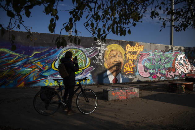 Graffiti by artist Eme Freethinker with picture of US President Donald Trump and writing Goodbye Piece of Shit in Mauerpark in Berlin on November 12, 2020 Donald Trump Graffiti in Berlin