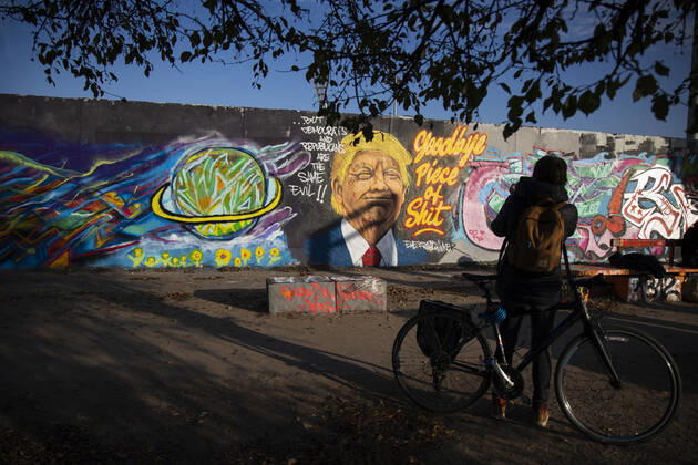 Graffiti by artist Eme Freethinker with picture of US President Donald Trump and writing Goodbye Piece of Shit in Mauerpark in Berlin on November 12, 2020 Donald Trump Graffiti in Berlin