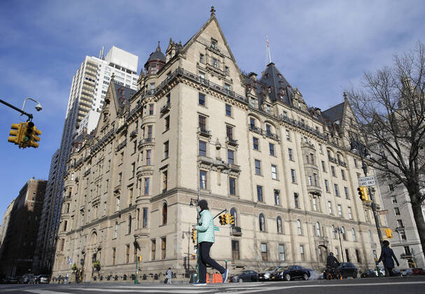 Pedestrians walk by The Dakota, the home of John Lennon, on the eve of the 40th anniversary of the night the Beatles legend was shot and killed by Mark Chapman in New York City on Monday. December 7, 2020. Strawberry Fields is a 2.5-acre landscaped section in New York City s Central Park that is dedicated to the memory of the former Beatles member.  NYP20201207104 JohnxAngelillo