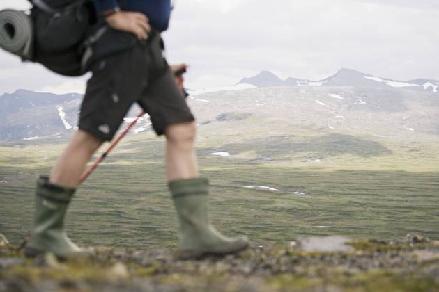 Low section of hiker walking against mountains , model released Copyright: xKentarooxTrymanx , MA49913