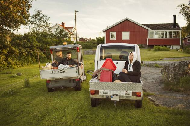 Young friends sitting in vehicles against house , model released Copyright: xMaskotx , MA58562
