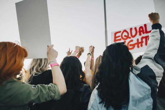 Rear view of women protesting for equal rights against sky in summer , model released Copyright: xMaskotx , MA69767