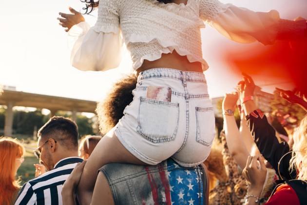 Man carrying friend on shoulder while enjoying at music festival , model released Copyright: xMaskotx , MA69912