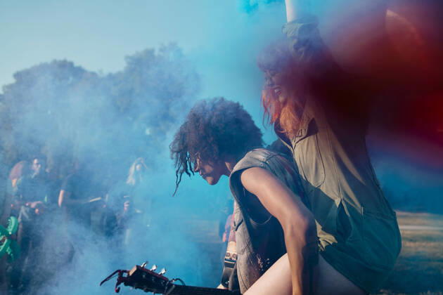 Man piggyback amidst blue powder paint while celebrating Holi , model released Copyright: xMaskotx , MA69925