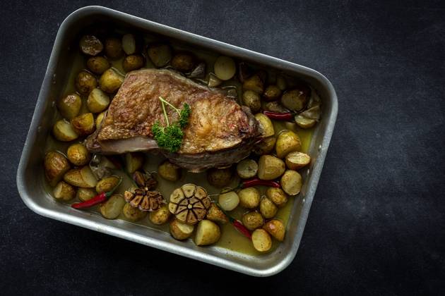 From Above a roast lamb with potatoes Copyright: xEduardoxLopezx Model Released