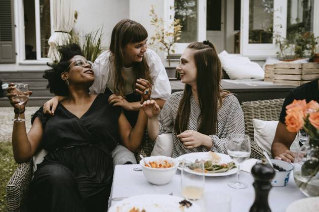 Smiling female friends talking while enjoying during social gathering Sweden, Stockholm, model released, property released Copyright: xMaskotx , MA83417