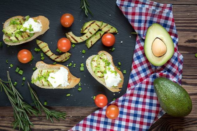 Bread with slices of avocado and cream cheese Bread with slices of grilled avocado and cream cheese on a black cutting stone board. Fresh parsley and rosemary. Vegetarian, vegan concept.avocado, toast, cream, cheese, food, bread, sandwich, green, white, healthy, fruit, meal, vegetable, snack, gourmet, lunch, breakfast, appetizer, delicious, natural, fresh, health, diet, tasty, dinner, vegetarian, slice, eating, tomato, raw, burger, butty, calories, cooking, dark, dietary, dietetic, genetically, organic, seasonal, seeds, spoon, spring, summer, vegan, vegetables,  Copyright: xViktoriaxKondysenkox 26168268