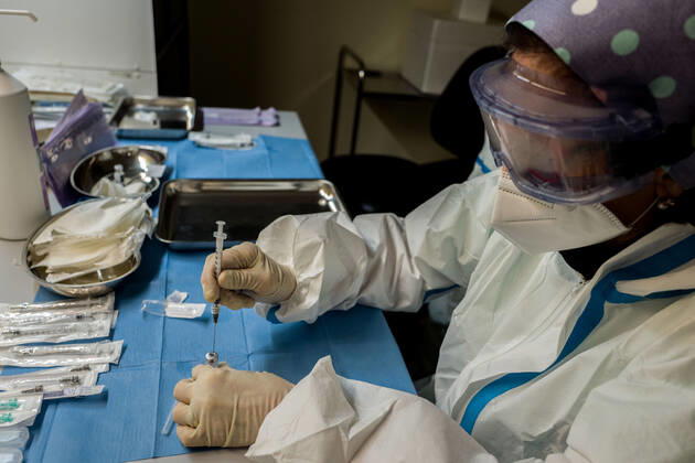 Milan. COVID19 Vaccine Mixing and preparation of the assay before administration Editorial Usage Only  Copyright: xCarloxCozzolix xIPAx