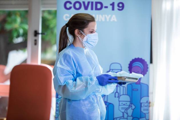 Nurse at the residence where Josefa PÃ rez, 89 years old, was the first woman to be vaccinated in Catalonia, during the first day of vaccination in Spain, at the Feixa Llarga retirement home in L Hospitalet de Llobregat, Barcelona (Spain), on 27 December 2020. The first doses of the vaccine developed by Pfizer and BioNtech laboratories arrived in Spain yesterday, December 26, at a Pfizer warehouse in Guadalajara by land from Puurs (Belgium). Starting Monday, weekly deliveries will be made to the autonomous communities with an average of 350,000 doses prioritized for four population groups: residents and health and social-health personnel in homes for the elderly and disabled; front-line health personnel; other health and social-health perso Copyright: xPauxVenteox 3494904