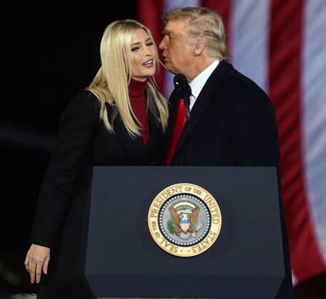 President Donald Trump kisses his daughter Ivanka Trump after introducing her to the the crowd at the Dalton Regional Airport at a Republican rally for Georgia Senators Kelly Loeffler and David Perdue in Dalton, Georgia on Monday, January 4, 2021.  ATL20210104113 TAMIxCHAPPELL