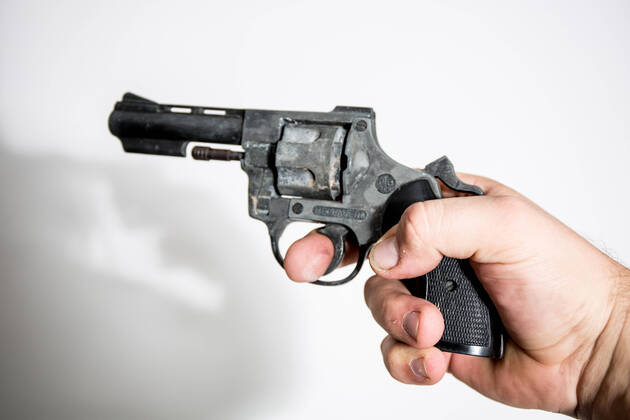 Bamberg, Germany 06 November 2020 symbol pictures 2020 A hand holding a revolver against a white background, feature symbol symbol photo characteristic detail Bavaria Copyright: xFotostandx xK.xSchmittx
