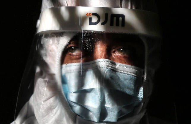 January 11, 2021, Deir Al-Balah, Gaza Strip, Palestinian Territory: A Palestinian medical worker wearing protective gear, takes a random swab sample for COVID-19 testing inside a mosque, in Deir al-Balah, central of Gaza Strip, on January 11, 2021. The Palestinian Authority (PA) has said it expects to receive its first COVID-19 vaccine doses in March under a deal with British drug giant AstraZeneca, and accused Israel of ignoring its responsibilities to ensure vaccines are available in occupied territory Deir Al-Balah Palestinian Territory - ZUMAap3_ 20210111_zaf_ap3_056 Copyright: xAshrafxAmrax