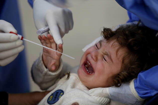 (210111) -- BEIRUT, Jan. 11, 2021 -- A health worker collects a COVID-19 PCR swab from a child at a hospital in Beirut, Lebanon, on Jan. 11, 2021. Lebanon s Higher Defense Council declared on Monday a state of emergency between Jan. 14-25 that includes a total lockdown in hope to restrict further spread of COVID-19, Al-Jadeed local TV channel reported. ) LEBANON-BEIRUT-COVID-19-STATE OF EMERGENCY BilalxJawich 