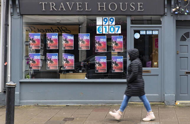January 11, 2021, Newport, Wales, United Kingdom: A pedestrian walks past the Travel House in Wales. Newport United Kingdom - ZUMAs197 20210111_zab_s197_010 Copyright: xMayxJamesx