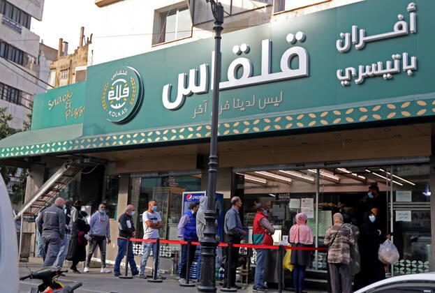 (210112) -- BEIRUT, Jan. 12, 2021 -- People buy bread from a bakery to prepare for a national COVID-19 lockdown in Beirut, Lebanon, Jan. 11, 2021. Lebanon s Higher Defense Council declared on Monday a state of emergency between Jan. 14-25 that includes a total lockdown in hope to restrict further spread of COVID-19, Al-Jadeed local TV channel reported. ) LEBANON-BEIRUT-COVID-19-LOCKDOWN BilalxJawich 