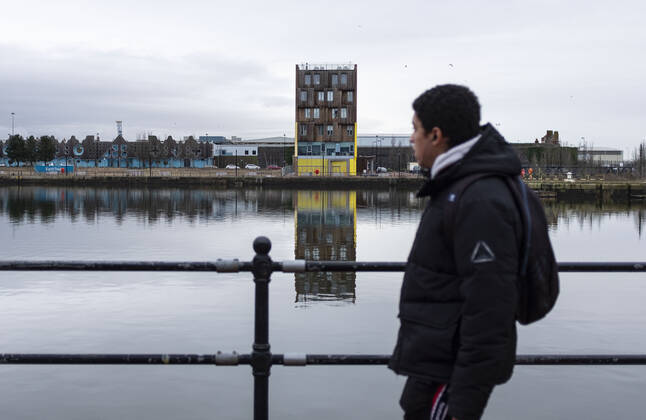 January 12, 2021, Cardiff, Wales, United Kingdom: A man walks by Britannia Quay at Cardiff Bay in Wales..1,332 new cases of the coronavirus have been recorded today bringing the total to 172,879 since the pandemic began. The overall death total now stands at 3,997 in Wales. The infection rate is now 403.5 cases per 100,000 people based on the seven days up to January 7. That is down on the 415 previously reported. Cardiff United Kingdom - ZUMAs197 20210112_zab_s197_003 Copyright: xMayxJamesx