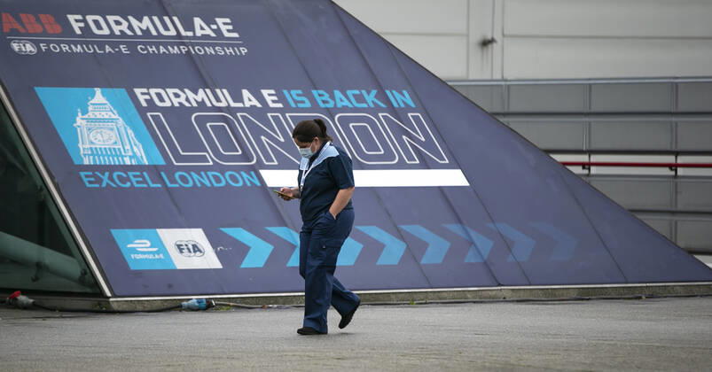 (210113) -- LONDON, Jan. 13, 2021 -- A staff wearing a face mask walks into the Vaccination Centre at ExCel exhibition centre in London, Britain, on Jan. 12, 2021. British Prime Minister Boris Johnson on Monday warned against false complacency as the country is seeking to speed up the coronavirus vaccine rollout. According to the prime minister, 2.4 million coronavirus jabs have been administered across Britain. Seven new mass vaccination sites in England opened Monday, as the country races against time to bring the pandemic under control. ) BRITAIN-LONDON-COVID-19-VACCINE ROLLOUT HanxYan 