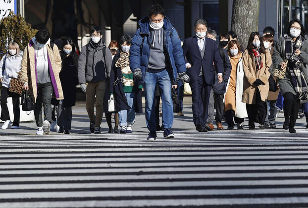 Suga to expand virus emergency to 7 more prefectures People wearing masks walk in Nagoya, Aichi Prefecture, on Jan. 13, 2021. Japanese Prime Minister Yoshihide Suga is set to declare a state of emergency in seven additional prefectures including Aichi later in the day amid a resurgence of coronavirus infections across Japan. 