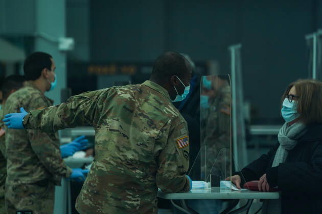 January 13, 2021, New York, New York, USA: A member of the US Army National Guard checks in people as New York State opens a mass vaccination site at the Jacob Javits Convention Center on Manhattan s West Side on January 13, 2021 in New York. New York USA - ZUMAb148 20210113_zap_b148_017 Copyright: xBryanxSmithx