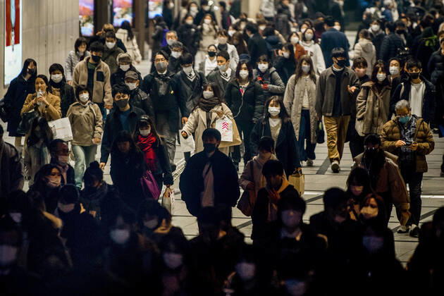 Day after Japan expands coronavirus emergency to 7 more prefectures People wearing face masks walk in Osaka s Umeda area on Jan. 14, 2021, a day after Japanese Prime Minister Yoshihide Suga declared a state of emergency in seven additional prefectures, including Osaka, amid the continued spread of the novel coronavirus. 