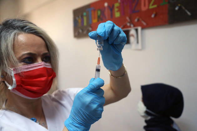 (210116) -- ANKARA, Jan. 16, 2021 -- A medical worker prepares a dose of China s Sinovac COVID-19 vaccine at the Sabiha Uzun Maternal Child Health Center in Ankara, Turkey on Jan. 15, 2021. More than 600,000 health workers in Turkey have received their first doses of COVID-19 shots developed by China s Sinovac during the first two days of the country s vaccination program, Turkish Health Ministry s data showed on Friday. (Photo by Xinhua) TURKEY-ANKARA-HEALTH WORKER-COVID-19-VACCINATION MustafaxKaya 